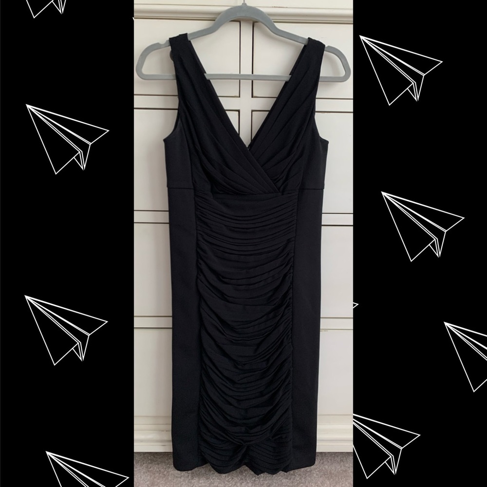 Black form fitting sleeveless dress